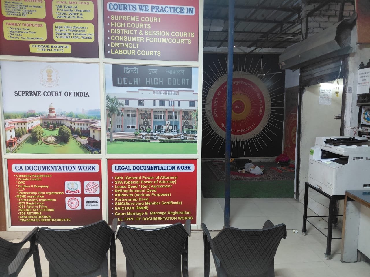 Legal services office interior with Supreme Court of India and Delhi High Court boards showing practice areas